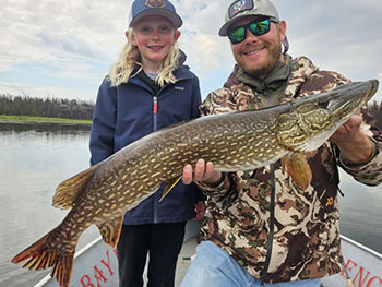 Father and Daughter holding large fish 5