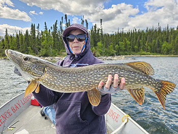 Woman holding large fish 1