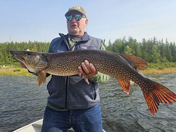 Man holding large fish 7