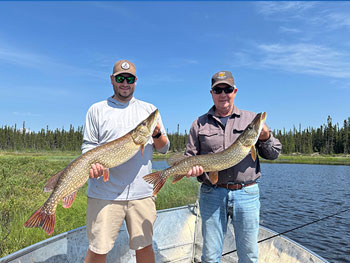 Two Men holding Two large fish 2